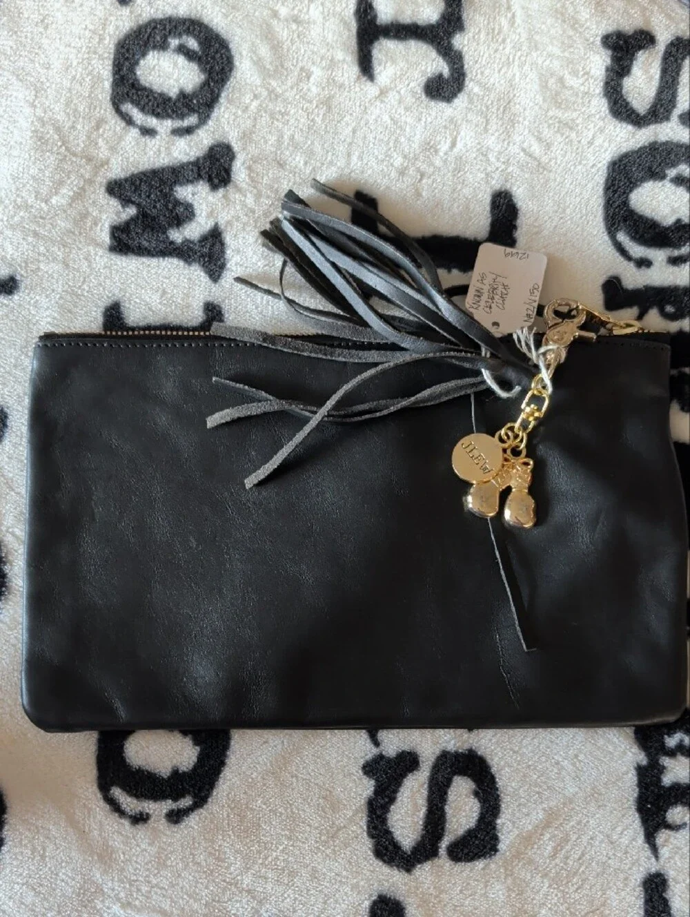 Black Leather Tassel Wristlet Clutch with Gold Accents